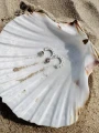 Kolczyki promienie słońca rozeta pół słońca srebro 925 sztyft na plaży